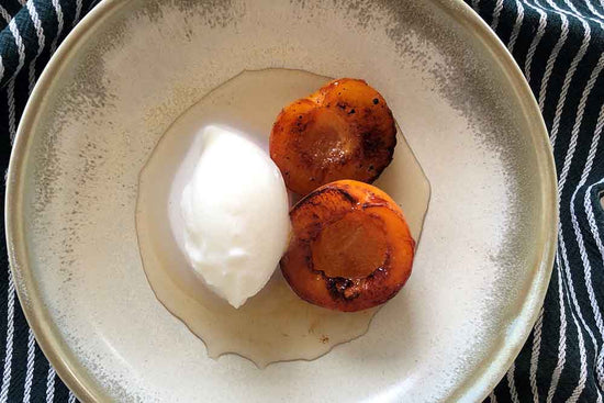 CARDAMOM MILK SORBET WITH GRILLED PEACHES AND CARDAMOM & HONEY SYRUP