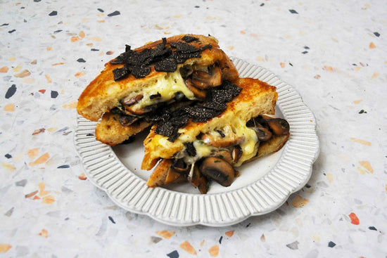 MUSHROOM AND PROVOLONE CHEESE SOURDOUGH TOASTIE WITH SHAVED TRUFFLE